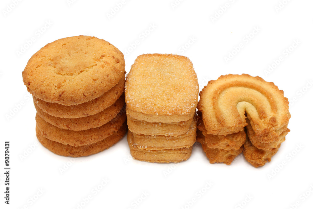 Many pieces of cookies stacked on white background. Many pieces of cookies stacked on white background.