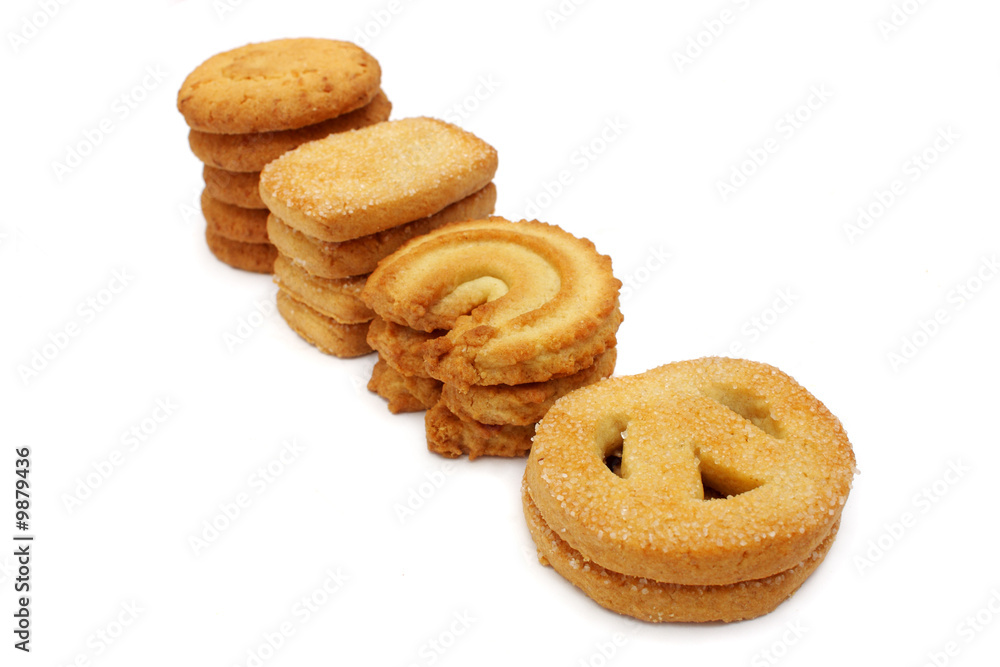 Many pieces of cookies stacked on white background. Many pieces of cookies stacked on white background.