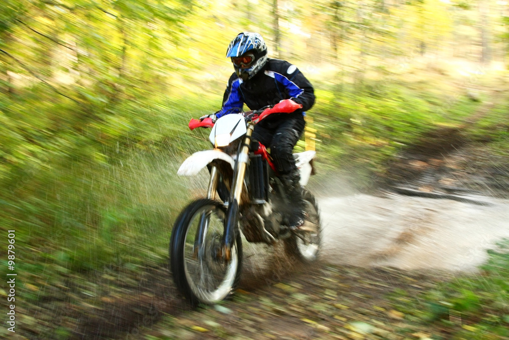 Offroad motorbike crossing river, water splashing. Motion blur. Offroad motorbike crossing river, water splashing. Motion blur.