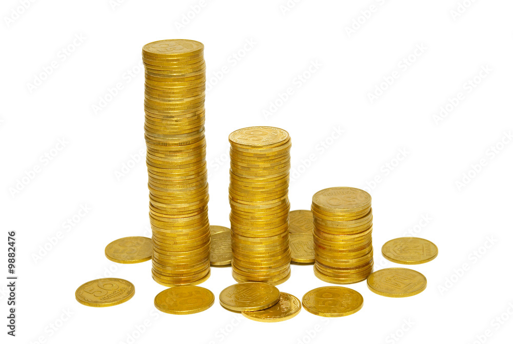 Stacks of golden coins isolated on white. Stacks of golden coins isolated on white.