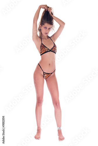 A young sexy adult girl in bikini isolated on white