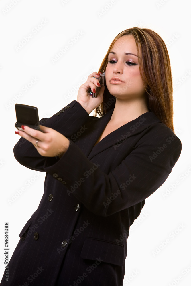 woman using cell phone and a pager text messaging woman using cell phone and a pager text messaging