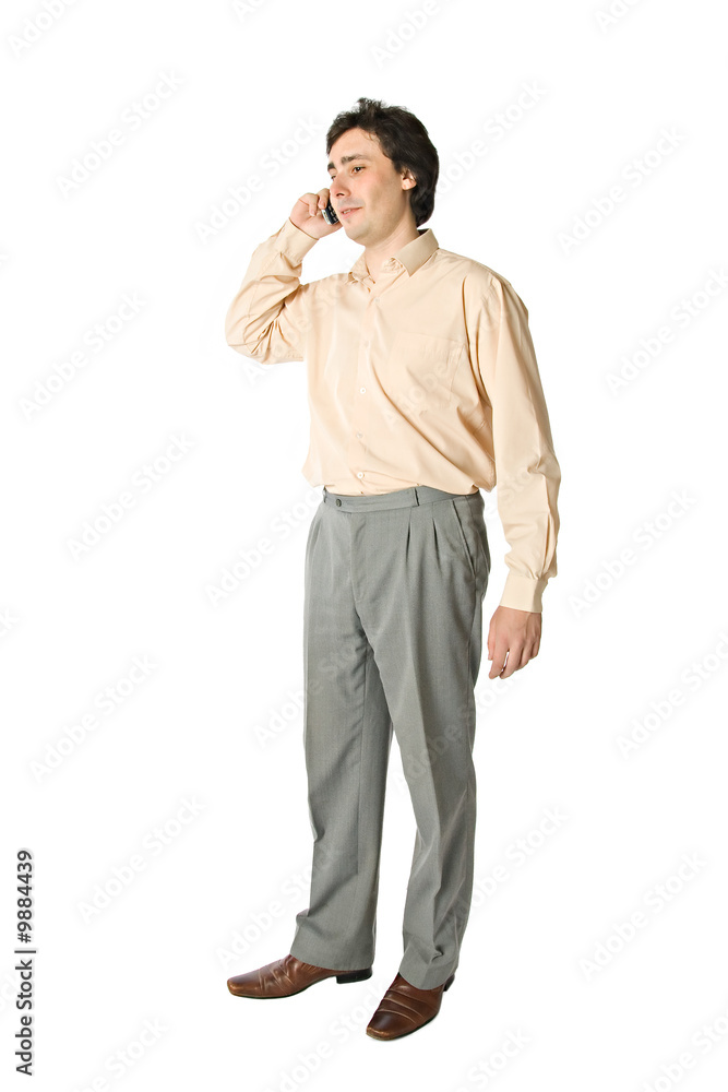 Standing man with a cellphone, over white Standing man with a cellphone, over white