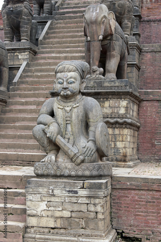Statues on the steps of a Hindu Temple in Nepal
