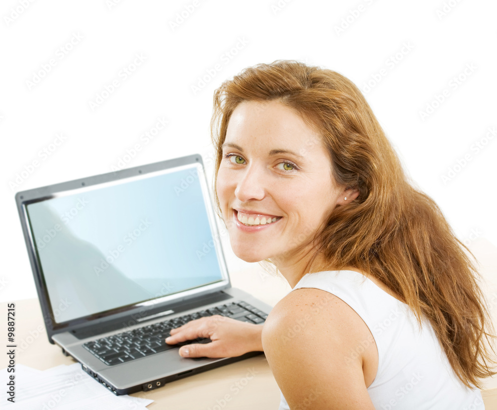 Smiling businesswoman touching keys of laptop near by Smiling businesswoman touching keys of laptop near by