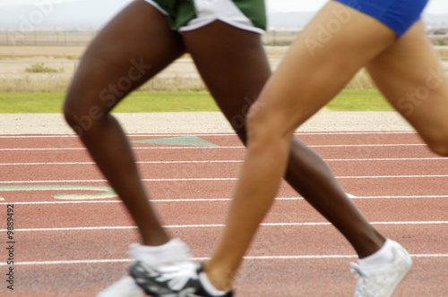 Women's 1500 meter run during a college track meet. © Jim