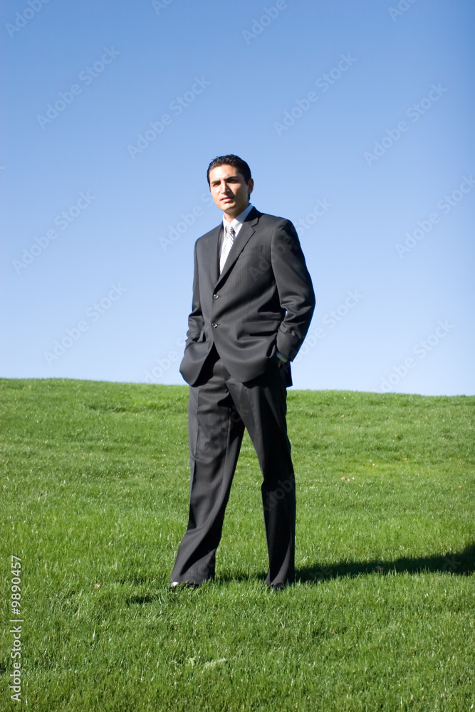 Confident businessman in dark suit. Confident businessman in dark suit.