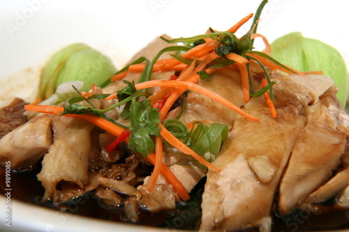 Chicken cooked in soy sauce for Hainanese chicken rice.