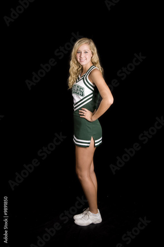 beautiful blond cheerleader in uniform, isolated