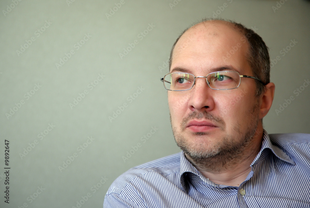 Portrait of the serious man in glasses Portrait of the serious man in glasses