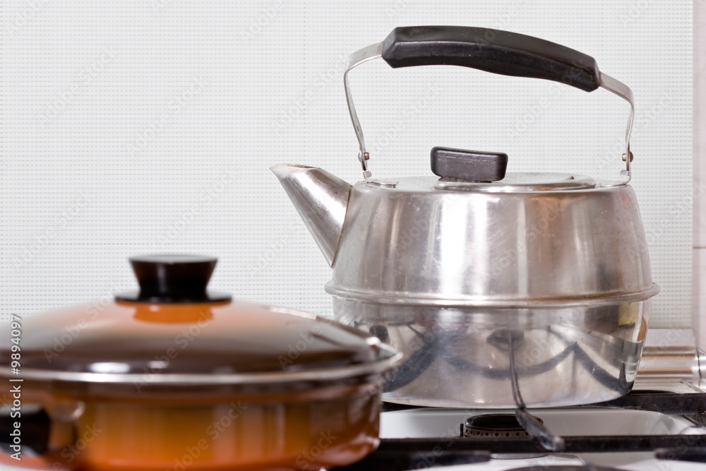 pan and kettle on the gas cooker