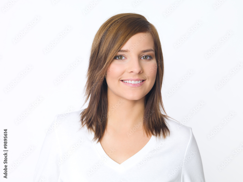 Portrait of beautiful young woman wearing white blouse