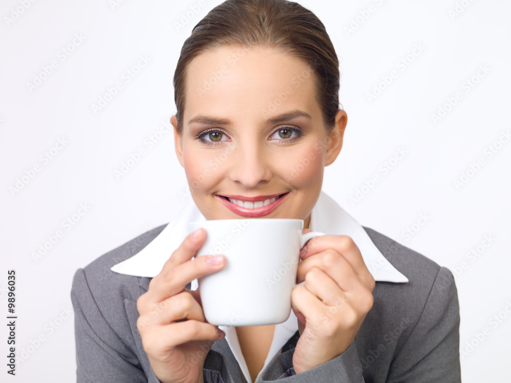 Portrait of beautiful and young business woman with coffee cup Portrait of beautiful and young business woman with coffee cup