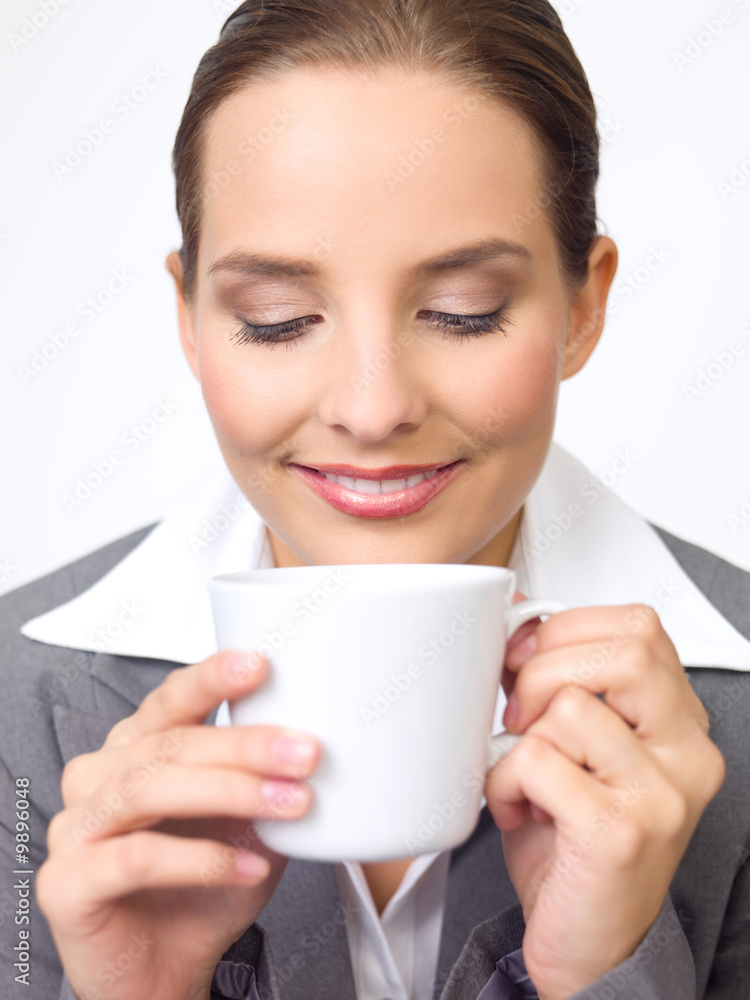 Portrait of beautiful and young business woman with coffee cup Portrait of beautiful and young business woman with coffee cup
