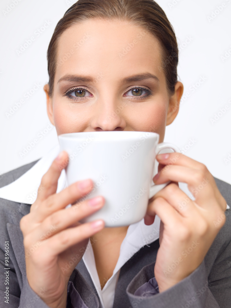 Portrait of beautiful and young business woman with coffee cup Portrait of beautiful and young business woman with coffee cup