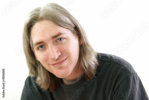Thirty something year old man with long salt and pepper hair