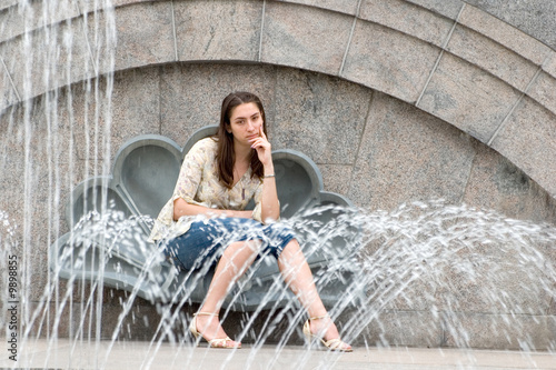 Attractive woman near fountain