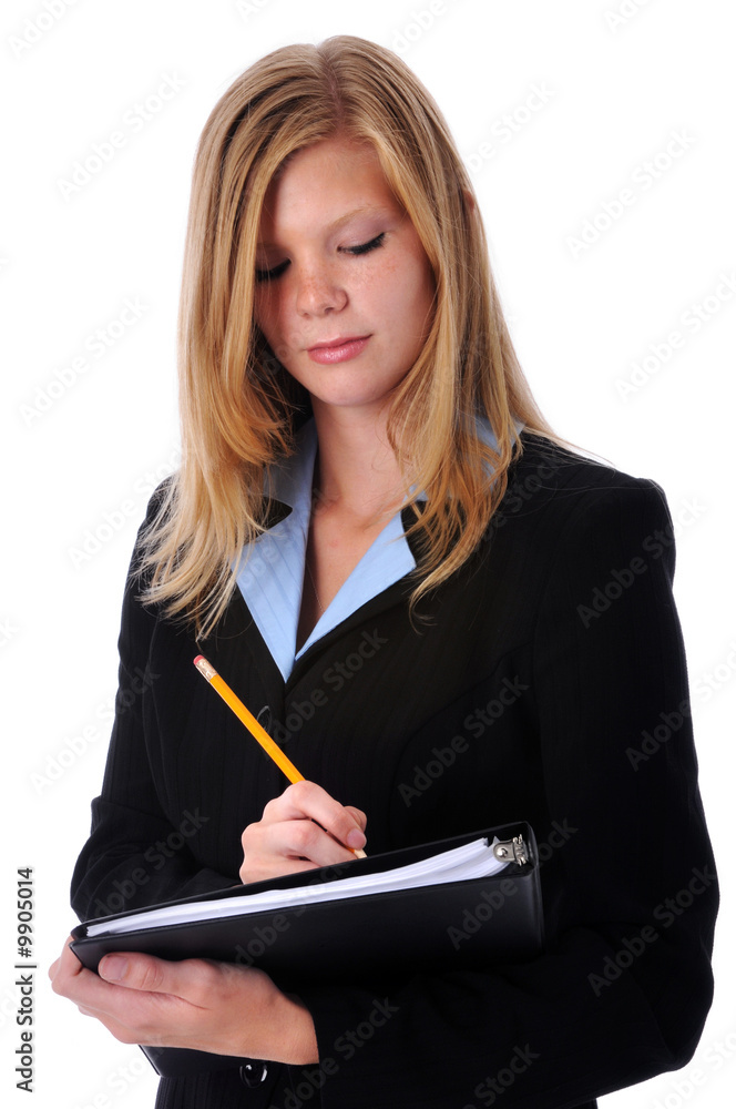 Young attractive businesswoman writting with a pencil Young attractive businesswoman writting with a pencil
