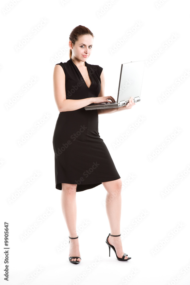 An isolated shot of a caucasian businesswoman carrying a laptop An isolated shot of a caucasian businesswoman carrying a laptop