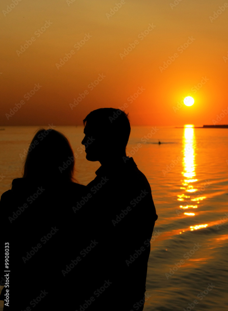Silhouette of family in sunset