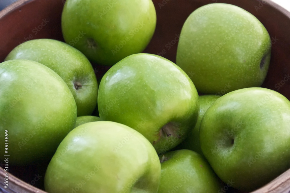 close up of bowl full of green granny smith apples close up of bowl full of green granny smith apples