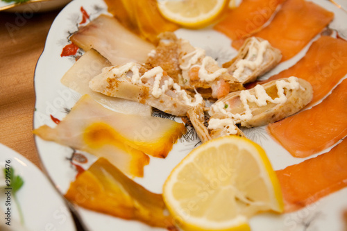 red fish and lemon on the plate