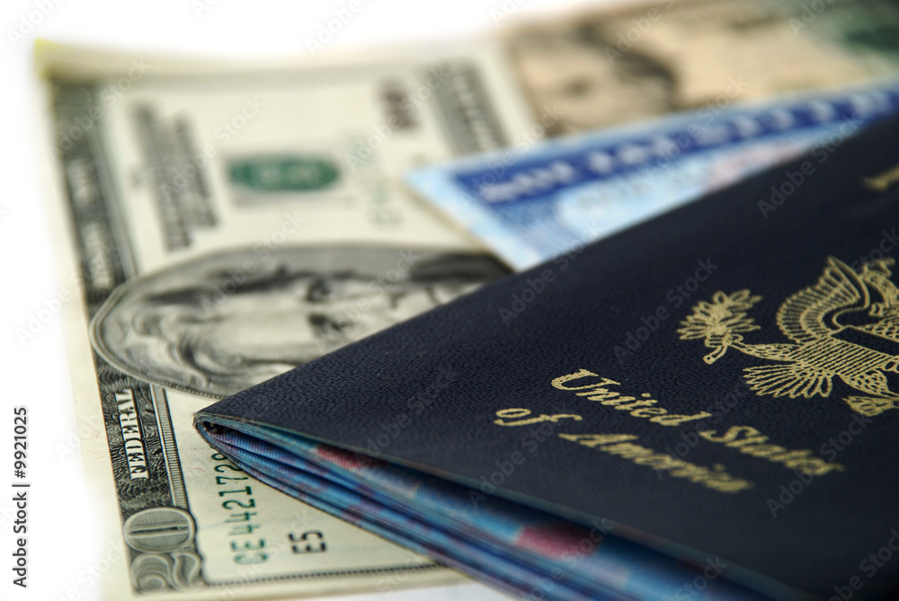 social security card, a passport and several dollar notes social security card, a passport and several dollar notes