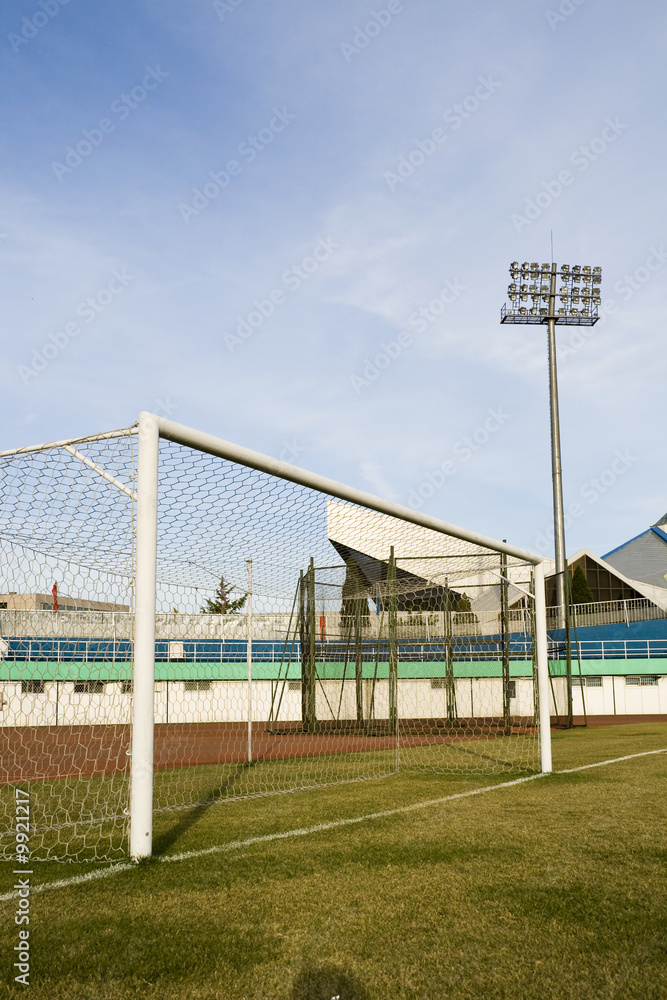 Soccer goalpost in empty football stadium