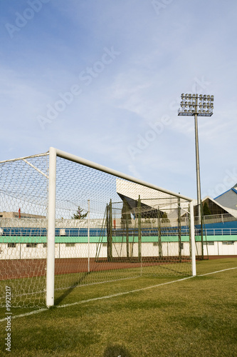 Soccer goalpost in empty football stadium
