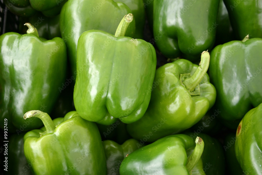 A large group of beautiful green peppers A large group of beautiful green peppers