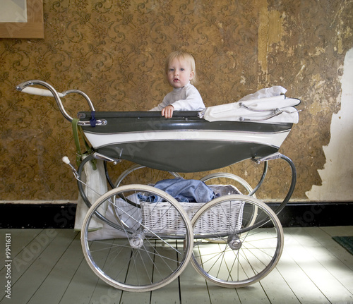 baby in a  1950's Silver Cross perambulater