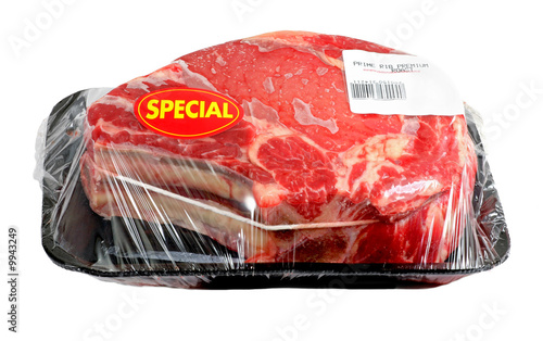 Billede på lærred A prime rib roast  wrapped in cellophane or plastic wrap.