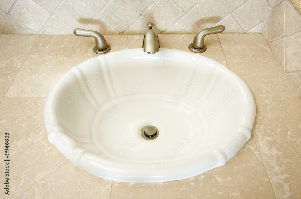 Fototapeta premium Shell Shaped Sink and Faucet and Tile Counter
