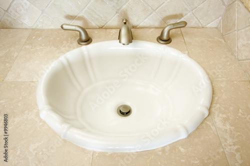 Shell Shaped Sink and Faucet and Tile Counter