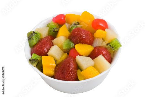 Colorful fruit salad isolated on white