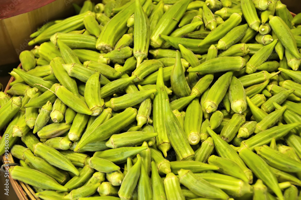 Farmers Market with a basket of okra ready to purchase