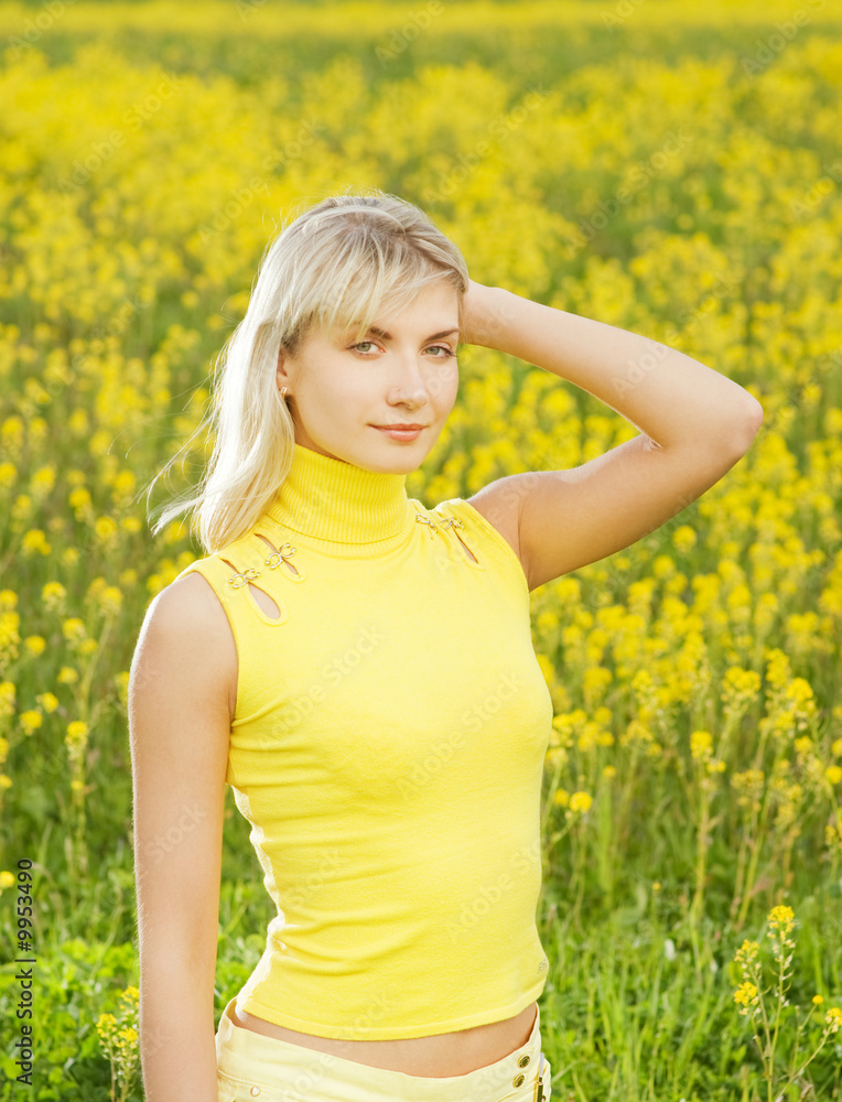 Beautiful young woman in a flower field Beautiful young woman in a flower field
