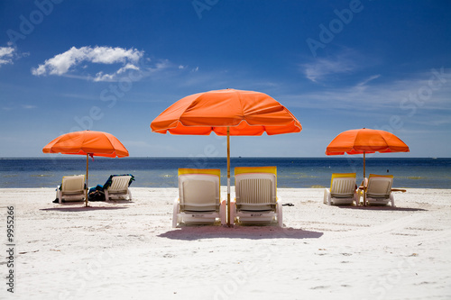 sunny beach with umbrellas