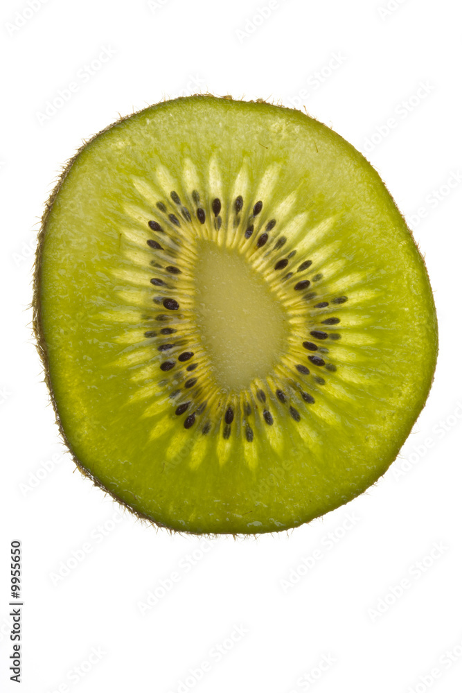 closeup of a translucent slice of kiwi closeup of a translucent slice of kiwi