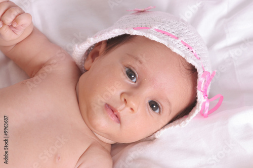 cute baby girl in beautiful white hat © Elena kouptsova