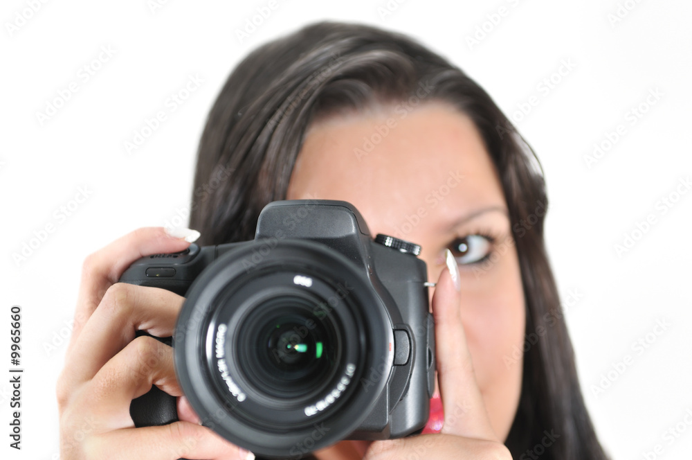 Young woman holding camera in hand taking picture isolated Young woman holding camera in hand taking picture isolated