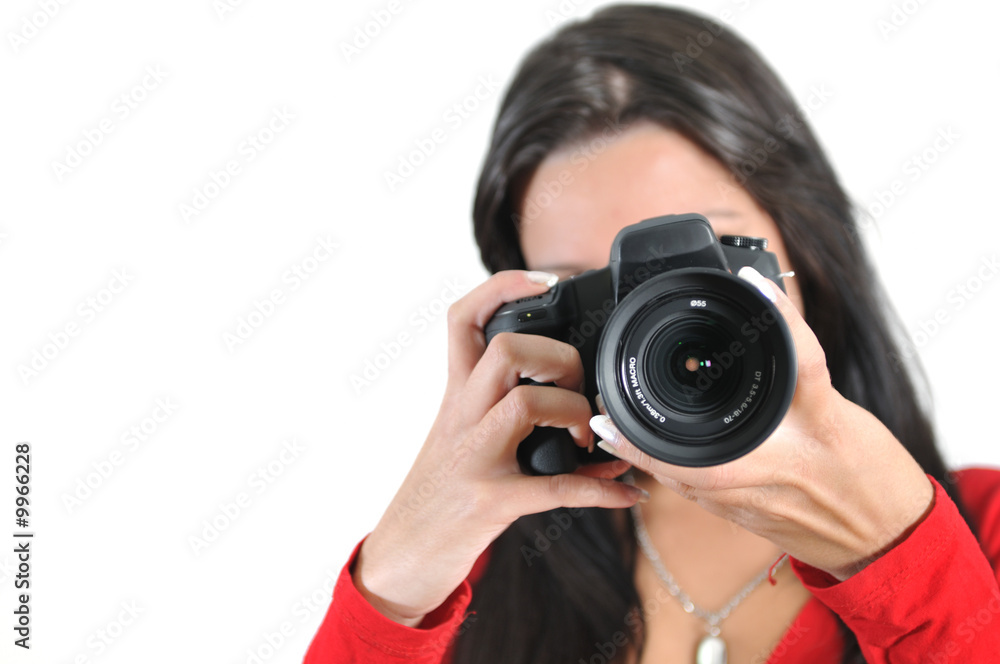 Young woman holding camera in hand taking picture isolated Young woman holding camera in hand taking picture isolated