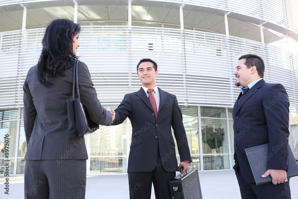 An attractive business team handshake at office building An attractive business team handshake at office building