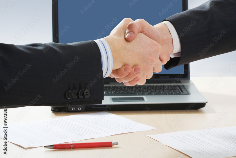 Close-up of two businessmen’s handshake Close-up of two businessmen’s handshake
