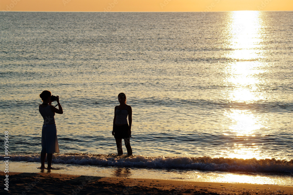 Fototapeta premium photographe et modele a la plage