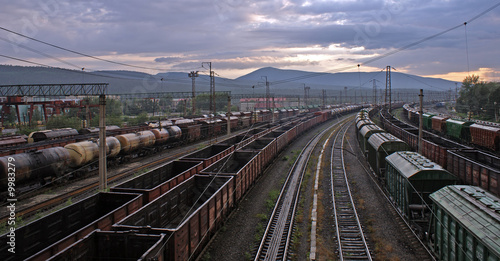 photo of railway station with different trains