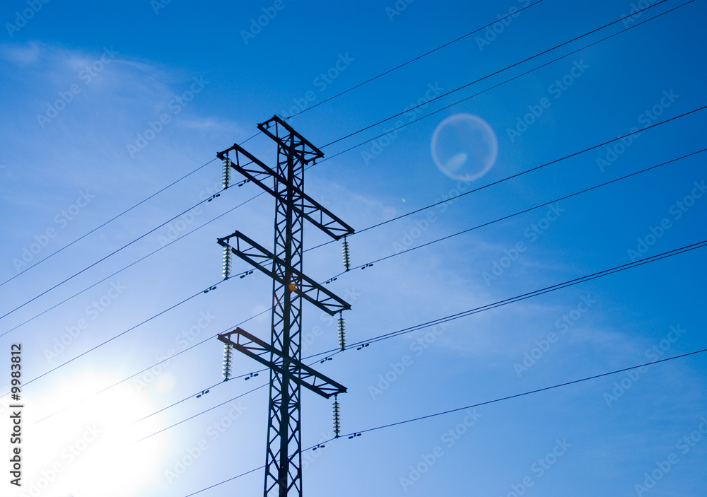 electrical tower with sun and flare electrical tower with sun and flare