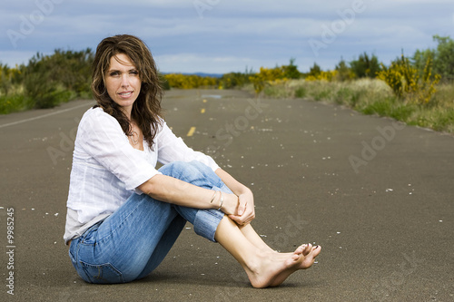 beautiful  pretty  sexy  attractive woman sitting in the road