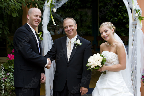 Father giving away daughter on wedding day