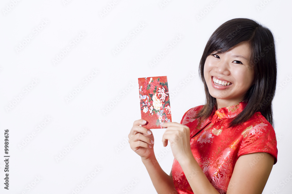 Oriental girl with cheongsam wishing you Happy Chinese New Year. Oriental girl with cheongsam wishing you Happy Chinese New Year.